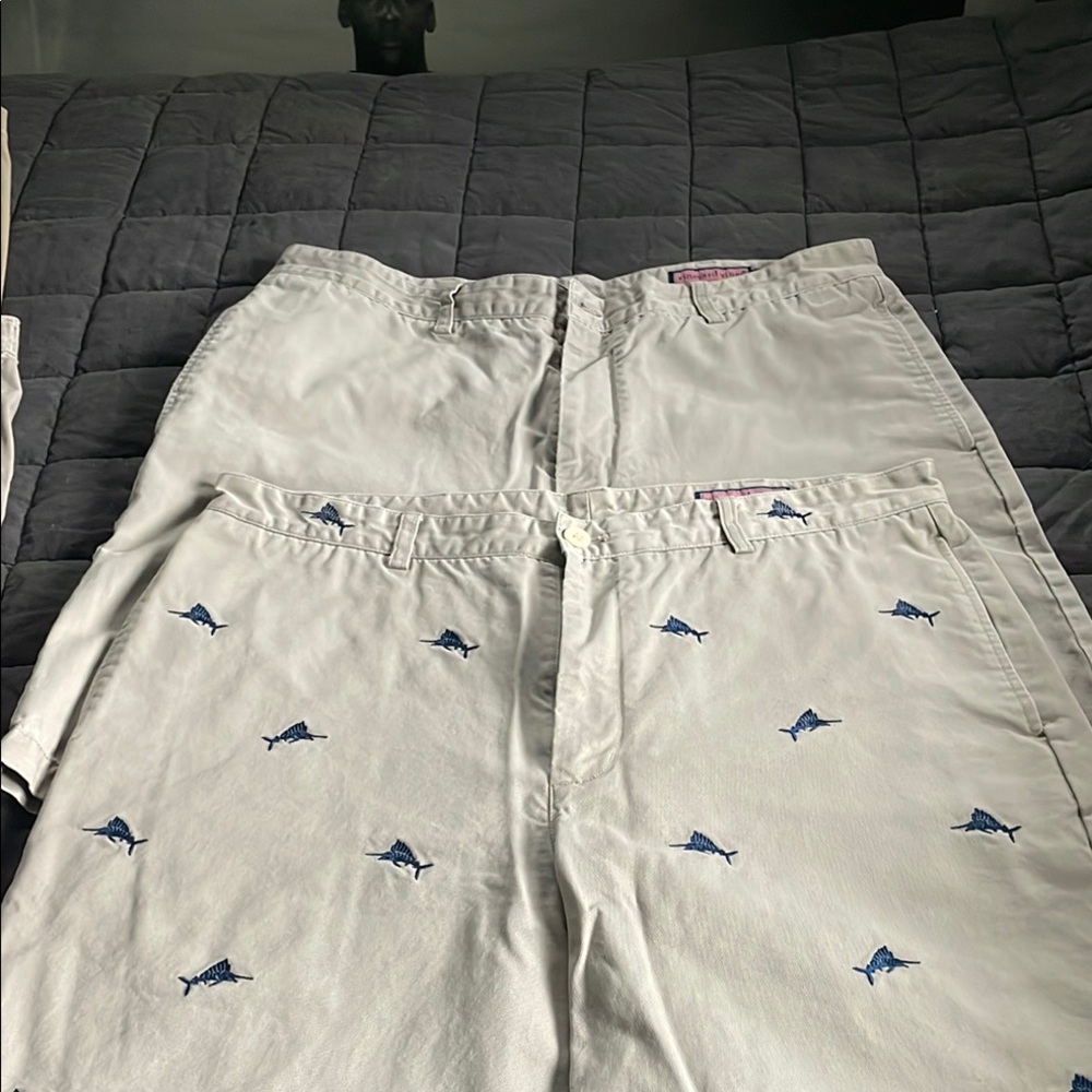 Two pair men’s khaki shorts one with Embroidered Shark Pattern